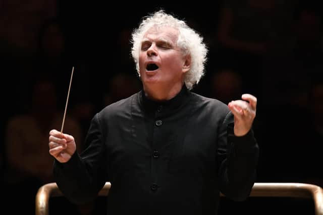 Sir Simon Rattle conducting the London Symphony Orchestra (PIC Doug Peters)