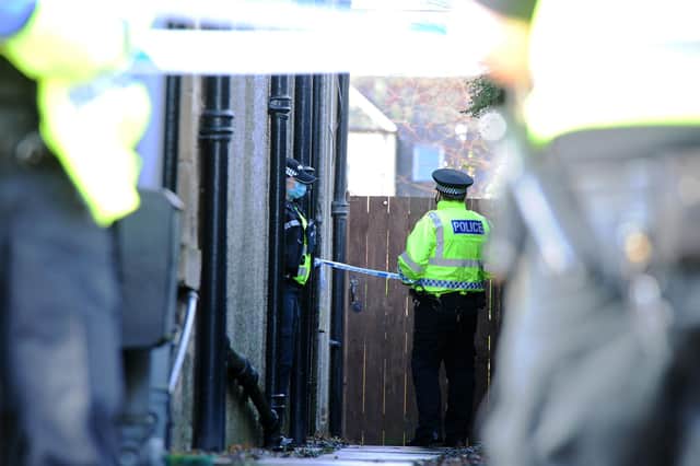 An area between Grahams Road Dental Surgery and Marley's Artisan Chocolates has been taped off.