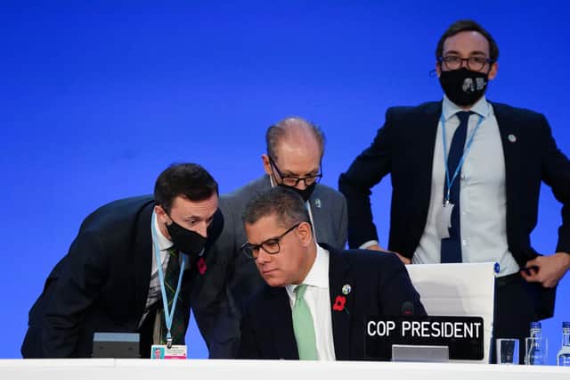 COP26 President Alok Sharma taking advice before postponing the latest session of the late-running conference today. Picture: Jane Barlow/PA Wire