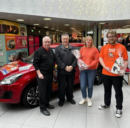 Alan Pirie, chairman of the organising committee; Gordon Arthur Irvine, milestone ticket holder, Carol McDonald from C&M McDonald and Ollie Middleton from Charlie House