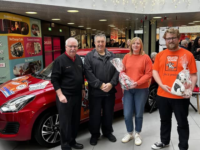 Alan Pirie, chairman of the organising committee; Gordon Arthur Irvine, milestone ticket holder, Carol McDonald from C&M McDonald and Ollie Middleton from Charlie House