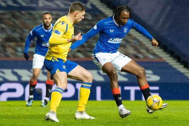 Rangers' Joe Aribo (R) holds off St Johnstone's Liam Gordon during the Scottish Premiership match between Rangers and St Johnstone at Ibrox Stadium, on February 03, 2021, in Glasgow, Scotland. (Photo by Alan Harvey / SNS Group)