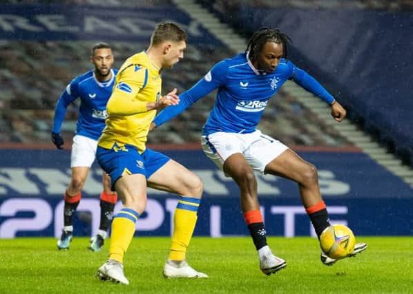 Rangers' Joe Aribo (R) holds off St Johnstone's Liam Gordon during the Scottish Premiership match between Rangers and St Johnstone at Ibrox Stadium, on February 03, 2021, in Glasgow, Scotland. (Photo by Alan Harvey / SNS Group)
