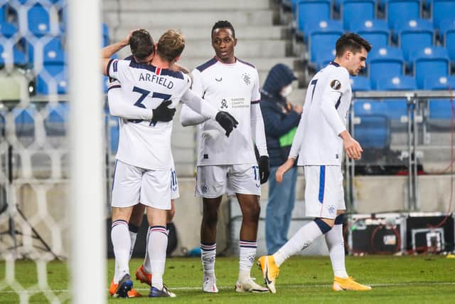Rangers' Swiss forward Cedric Itten (L) celebrates scoring a goal with Scott Arfield and team mates during the UEFA Europa League Group D match against Lech Poznan (Photo by Adam JASTRZEBOWSKI / AFP)