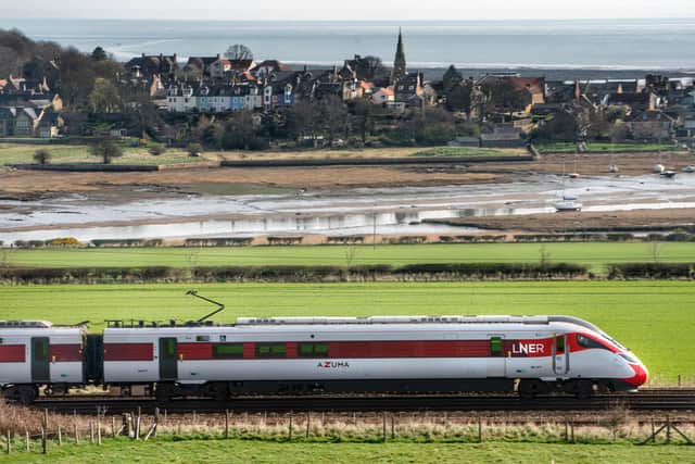 The LNER Azuma as it powers along the spectacular East Coast Line past the picturesque Northumbrian village of Alnmouth.