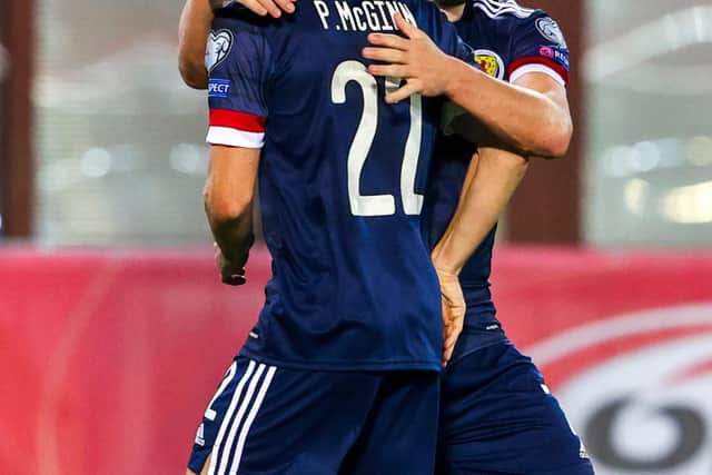 Scotland's John McGinn and Paul McGinn celebrate at full time against Austria.