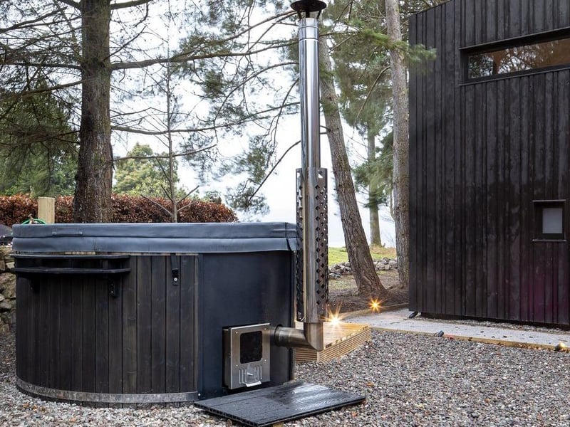 The back garden of Coorie has a hot tub - perfect for stargazing on a clear night.