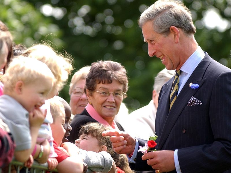 Prince Charles chatting to local people who gathered to see him during a visit to Sighthill Youth Centre in Glasgow in June 2003.