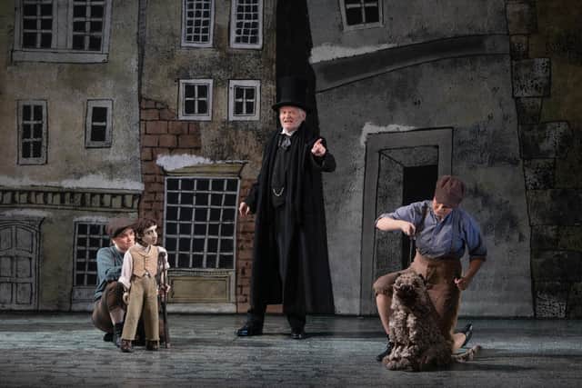 Left to right: Stacey Mitchell as Tiny Tim, Crawford Logan as Ebenezer Scrooge and Hannah Low as Greyfriars Bobby in An Edinburgh Christmas Carol PIC: Stuart Armitt