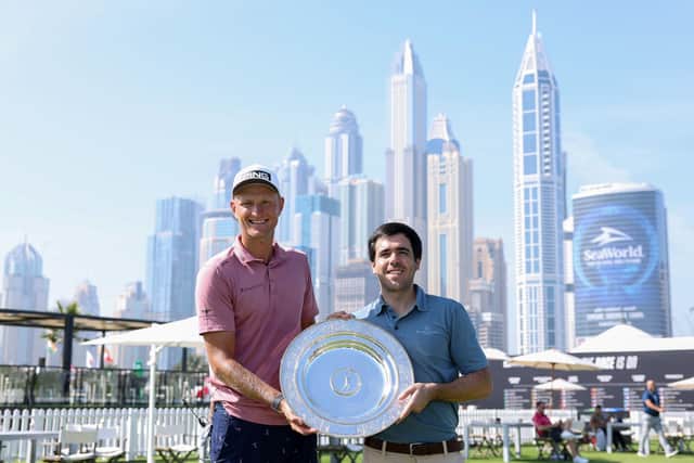 Pole Adrian Meronk is presented with the 2023 Seve Ballesteros Award by the Spaniard's son Javier on the driving range at Emirates Golf Club ahead of his appearance in this week's Hero Dubai Desert Classic. Picture: Richard Heathcote/Getty Images.