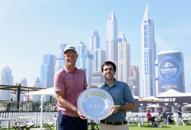 Pole Adrian Meronk is presented with the 2023 Seve Ballesteros Award by the Spaniard's son Javier on the driving range at Emirates Golf Club ahead of his appearance in this week's Hero Dubai Desert Classic. Picture: Richard Heathcote/Getty Images.