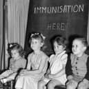 Four young children wait to be immunised against polio after a pandemic hit the UK in the 1940s and 1950s  (Photo by Terry Fincher/Getty Images)