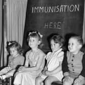 Four young children wait to be immunised against polio after a pandemic hit the UK in the 1940s and 1950s  (Photo by Terry Fincher/Getty Images)