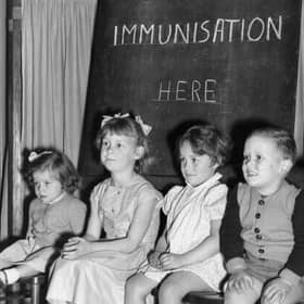 Four young children wait to be immunised against polio after a pandemic hit the UK in the 1940s and 1950s  (Photo by Terry Fincher/Getty Images)