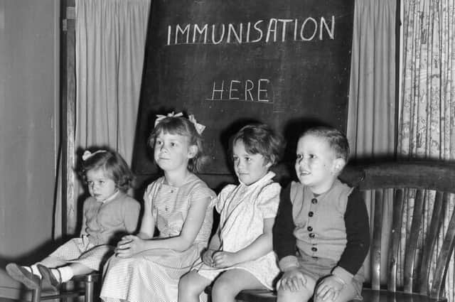 Four young children wait to be immunised against polio after a pandemic hit the UK in the 1940s and 1950s (Photo by Terry Fincher/Getty Images)