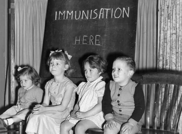Four young children wait to be immunised against polio after a pandemic hit the UK in the 1940s and 1950s  (Photo by Terry Fincher/Getty Images)