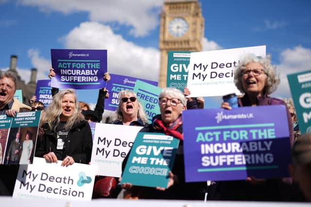 Campaigners in support of assisted dying protest outside Parliament in Westminster in London. Picture: Jordan Pettitt/PA Wire