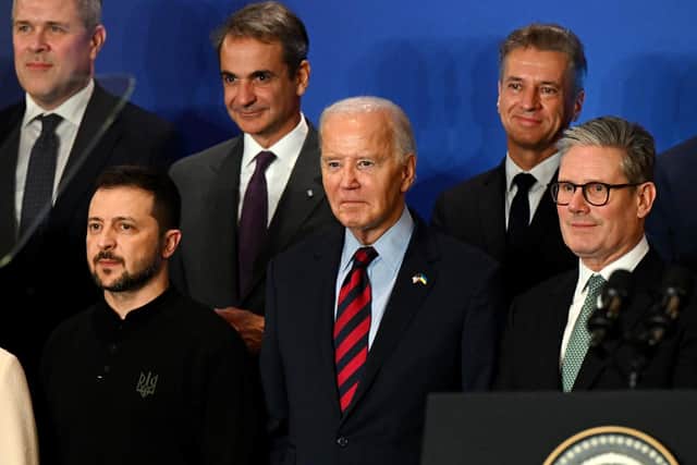 Ukrainian President Volodymyr Zelensky, U.S. President Joe Biden and Prime Minister Sir Keir Starmer pose for a group photo at an event concerning the recovery and reconstruction of Ukrainian. PIC: Leon Neal/PA Wire