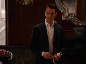 Jeremy Strong as Kendall Roy in Succession Season 4 Episode 10 'With Open Eyes', holding a piece of tape (Credit: HBO)