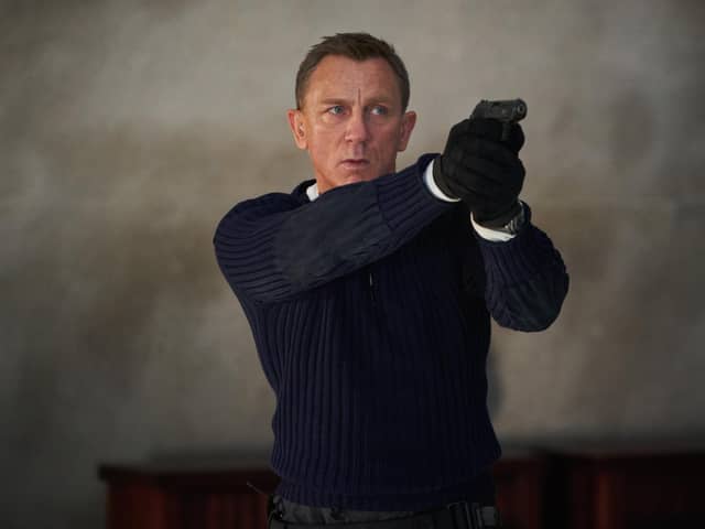 Daniel Craig playing James Bond in the new Bond film No Time To Die.