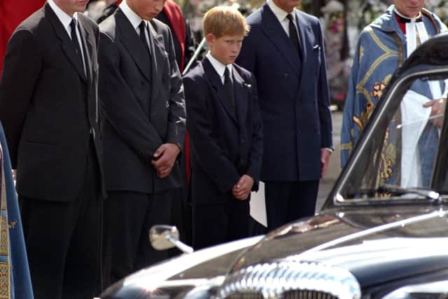 (Left-right) The Earl Spencer, Prince William, Prince Harry, and the Prince of Wales wait as the hearse carrying the coffin of Diana, Princess of Wales prepares to leave Westminster Abbey in London. Picture: Fiona Hanson/PA Wire