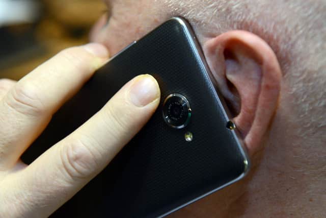 File photo of a man on a mobile phone call