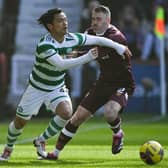 Celtic's Reo Hatate is tackled by Hearts' Michael Smith during Saturday's Scottish Cup quarter-final at Tynecastle. (Photo by Paul Devlin / SNS Group)