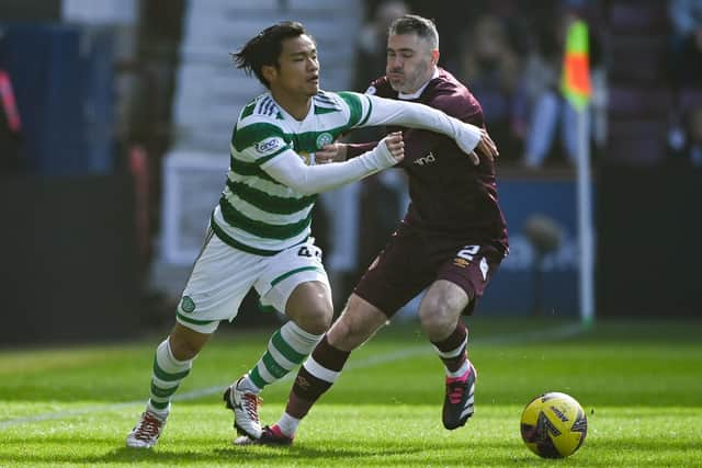 Celtic's Reo Hatate is tackled by Hearts' Michael Smith during Saturday's Scottish Cup quarter-final at Tynecastle. (Photo by Paul Devlin / SNS Group)