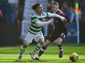 Celtic's Reo Hatate is tackled by Hearts' Michael Smith during Saturday's Scottish Cup quarter-final at Tynecastle. (Photo by Paul Devlin / SNS Group)