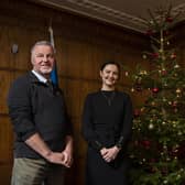 Around the Christmas tree at St Andrews House, Edinburgh are David Grieve (Highfield Forestry), Màiri McAllan and Stuart Goodall