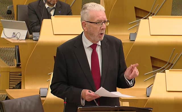 Constitution secretary Mike Russell had urged MSPs to āstand up and defend devolutionā