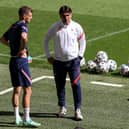 Croatia's coach Zlatko Dalic speaks with Borna Barisic during a training session at Wembley on Saturday (Photo by CATHERINE IVILL/POOL/AFP via Getty Images)
