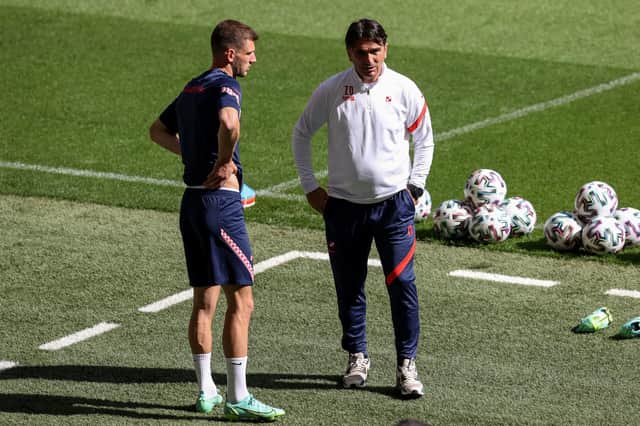 Croatia's coach Zlatko Dalic speaks with Borna Barisic during a training session at Wembley on Saturday (Photo by CATHERINE IVILL/POOL/AFP via Getty Images)