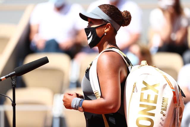 Naomi Osaka is refusing to speak to the media at the French Open but gave a short on-court interview following her first-round win over Patricia Maria Tig of Romania. Picture: Julian Finney/Getty Images