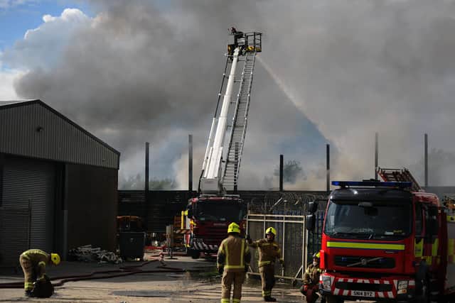 Firefighters tackle  a blaze in scrap yard at Angus Braidwood and Son Ltd on Castle Drive, Falkirk. (Pic: Michael Gillen)