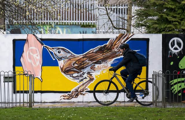 A new mural in Leith, Edinburgh, features a nightingale, the official national bird of Ukraine, against the country's flag.
