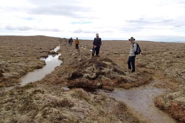 Members of the Back Historical Society unpick truth from fiction at the site of the Midnight Wall. PIC: Ian McHardy.