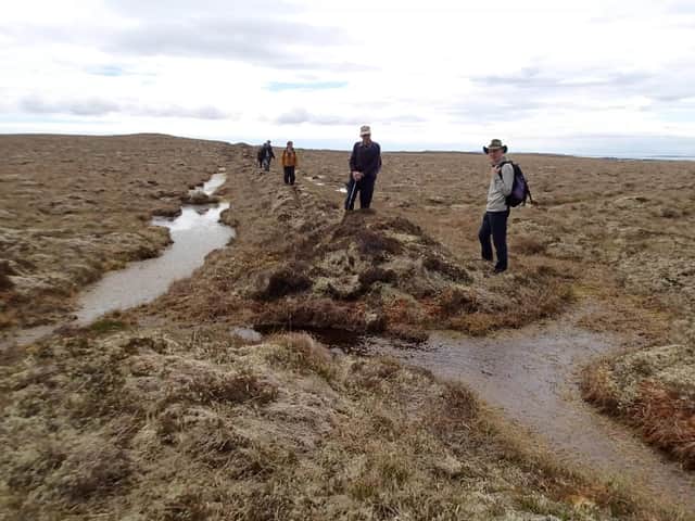 Members of the Back Historical Society unpick truth from fiction at the site of the Midnight Wall. PIC: Ian McHardy.