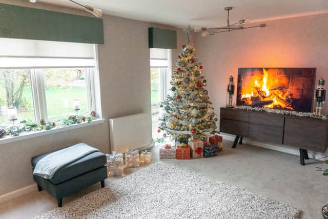 A formal lounge in the mews style townhouse, ready for Christmas