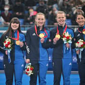 Winter Olympic curling gold medallists Britains Mili Smith, Hailey Duff, Jennifer Dodds, Vicky Wright and Eve Muirhead pose on the podium after their victory over Japan.