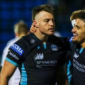 Jack Dempsey, left, is congratulated on his try against Dragons by Glasgow Warriors team-mate Sione Tuipulotu. (Photo by Craig Williamson / SNS Group)