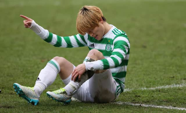 Celtic's Kyogo Furuhashi  shows his exasperation over the problem that forced off early into his team's 3-1 win away to St Johnstone. (Photo by Craig Williamson / SNS Group)