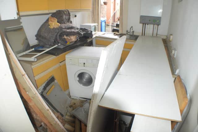 This is how the kitchen looked before the team began work to turn the vacant property back into a home