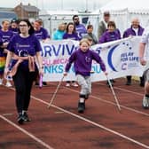 ​The event gets underway with the Survivors’ lap of honour.