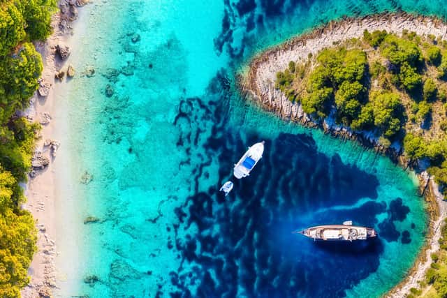 Yachts moored off a island in Croatia.