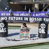 Protestors outside the Scottish Parliament in Edinburgh demonstrating against the UK's largest-ever price rises in fossil fuels.
