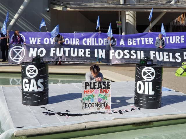 Protestors outside the Scottish Parliament in Edinburgh demonstrating against the UK's largest-ever price rises in fossil fuels.