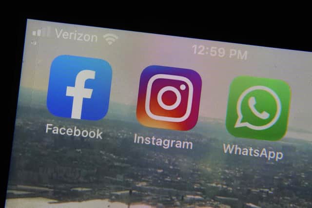 From left, the logos of Facebook, Instagram and WhatsApp. Picture: AP Photo/Richard Drew