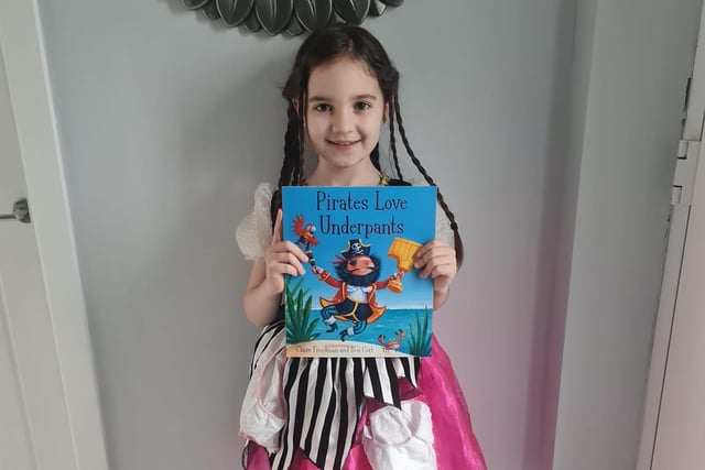 Emmie shows off her favourite book Pirates Love Underpants.