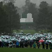 Patrons evacuate the grounds after play was suspended for the day due to weather conditions during the third round of the 2023 Masters at Augusta National Golf Club. Picture: Patrick Smith/Getty Images.